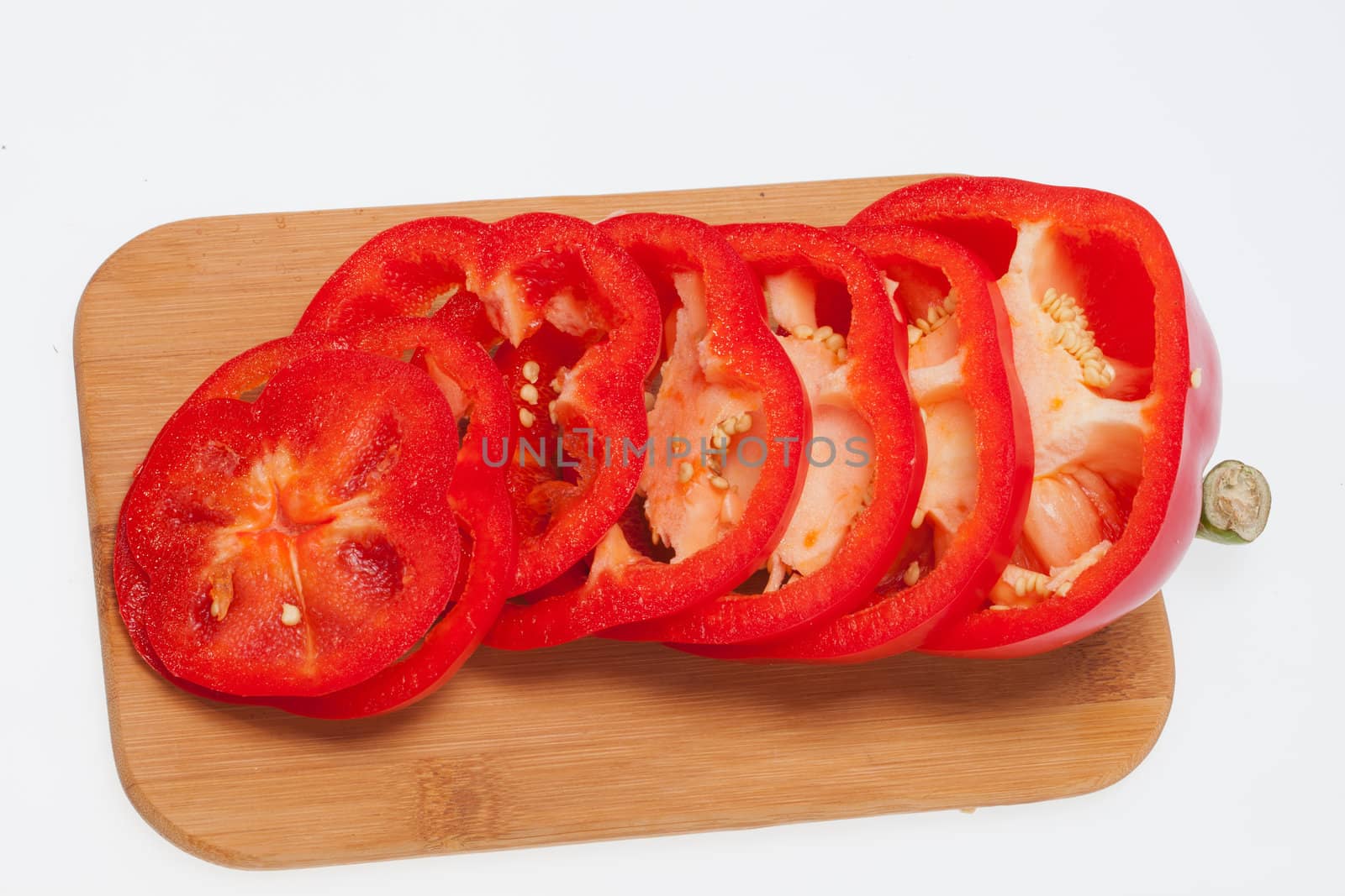 Sliced red pepper isolated on white background