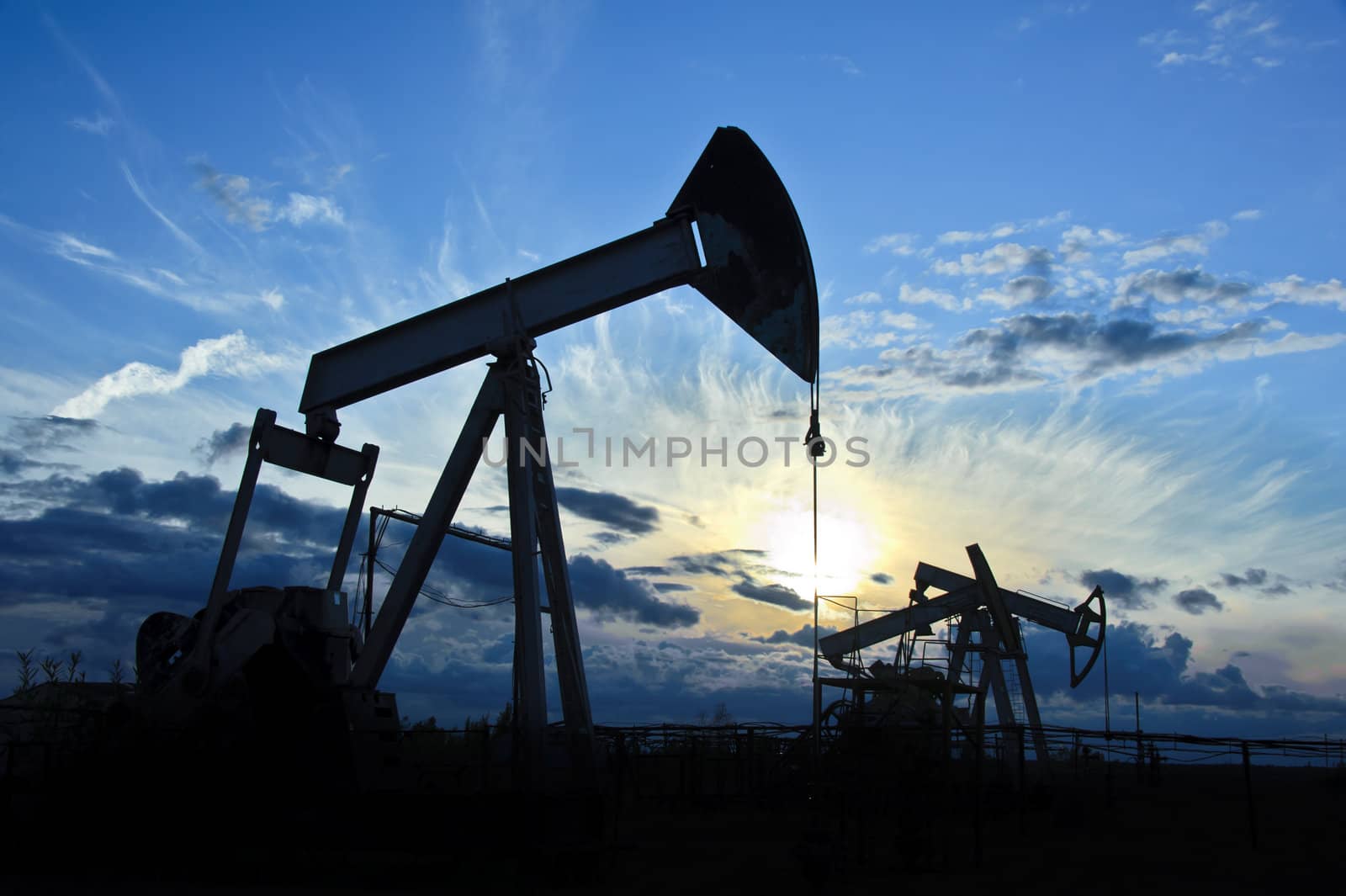 oil pumps on the sunset sky background 