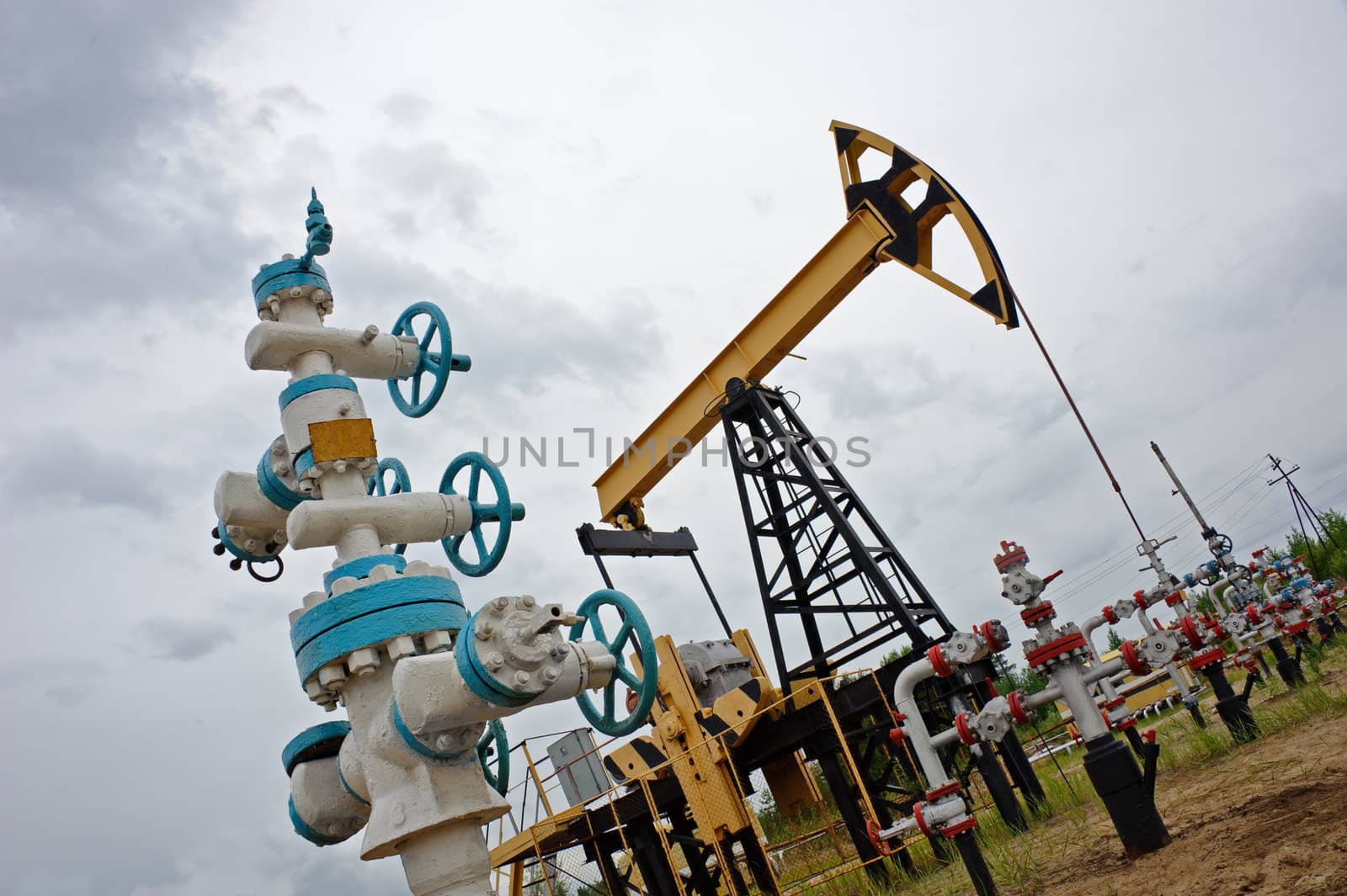 Extraction of oil. pumpjack and oilwell. Western Siberia. Russia.