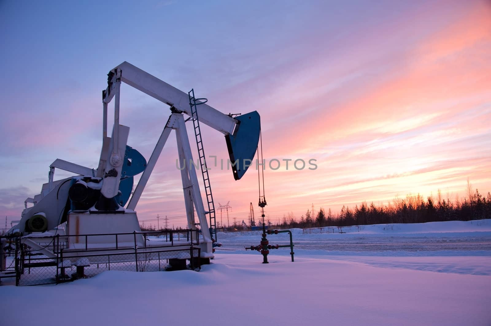 oil pump on the sunset sky background