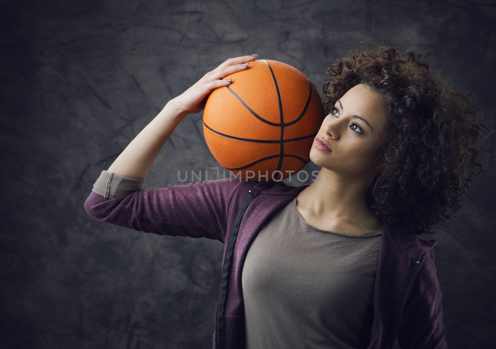 Fashion model  holding a basketball