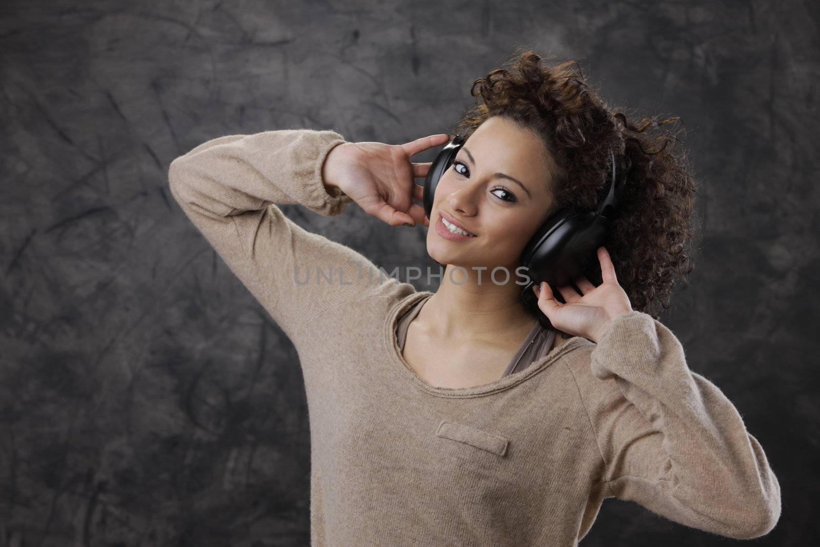 young beautiful woman enjoying music