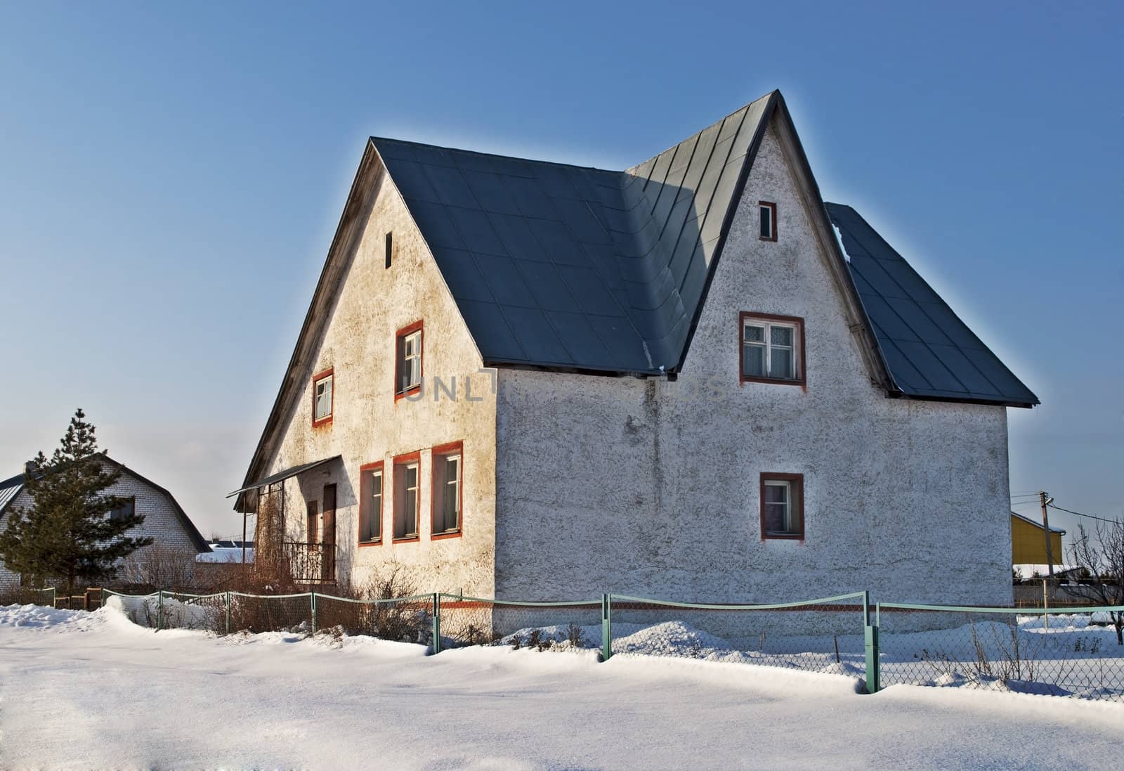 Old white stone cottage  in retro style, winter time