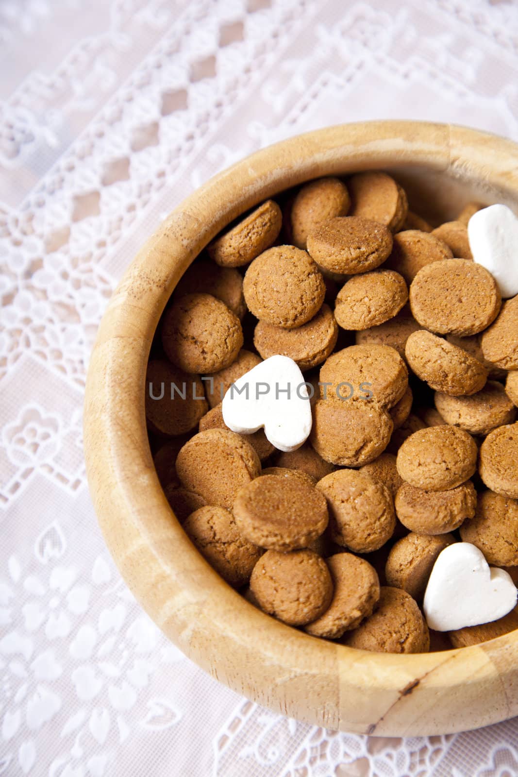 Dutch candy pepernoten in scale on table