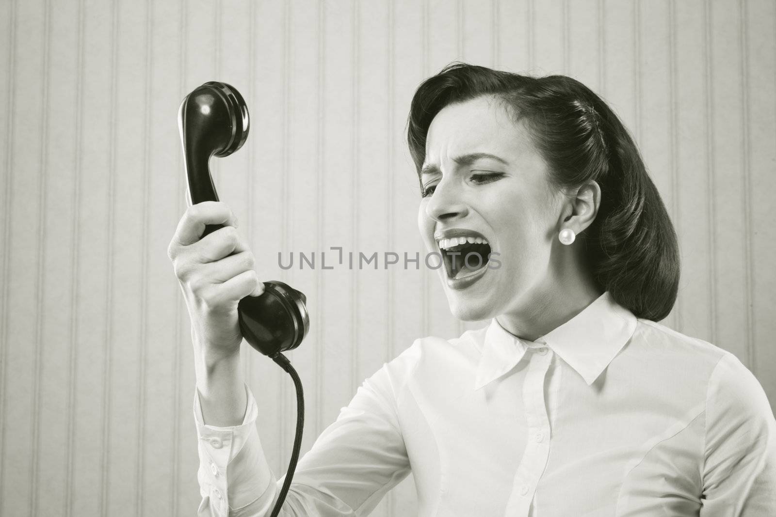 Young Woman shouting into telephone