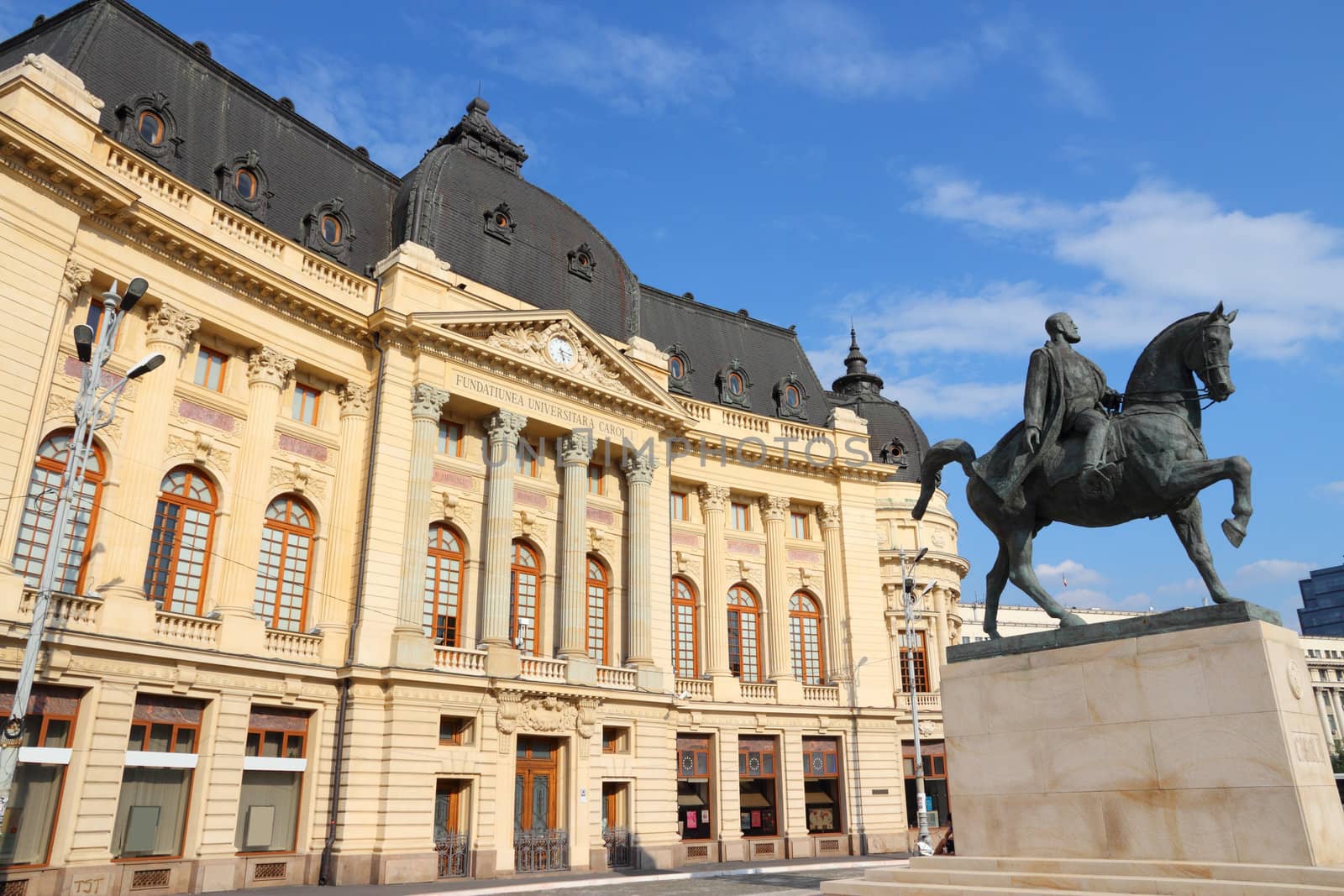 Bucharest, capital city of Romania. Central University Library and statue of king Carol I of Romania.