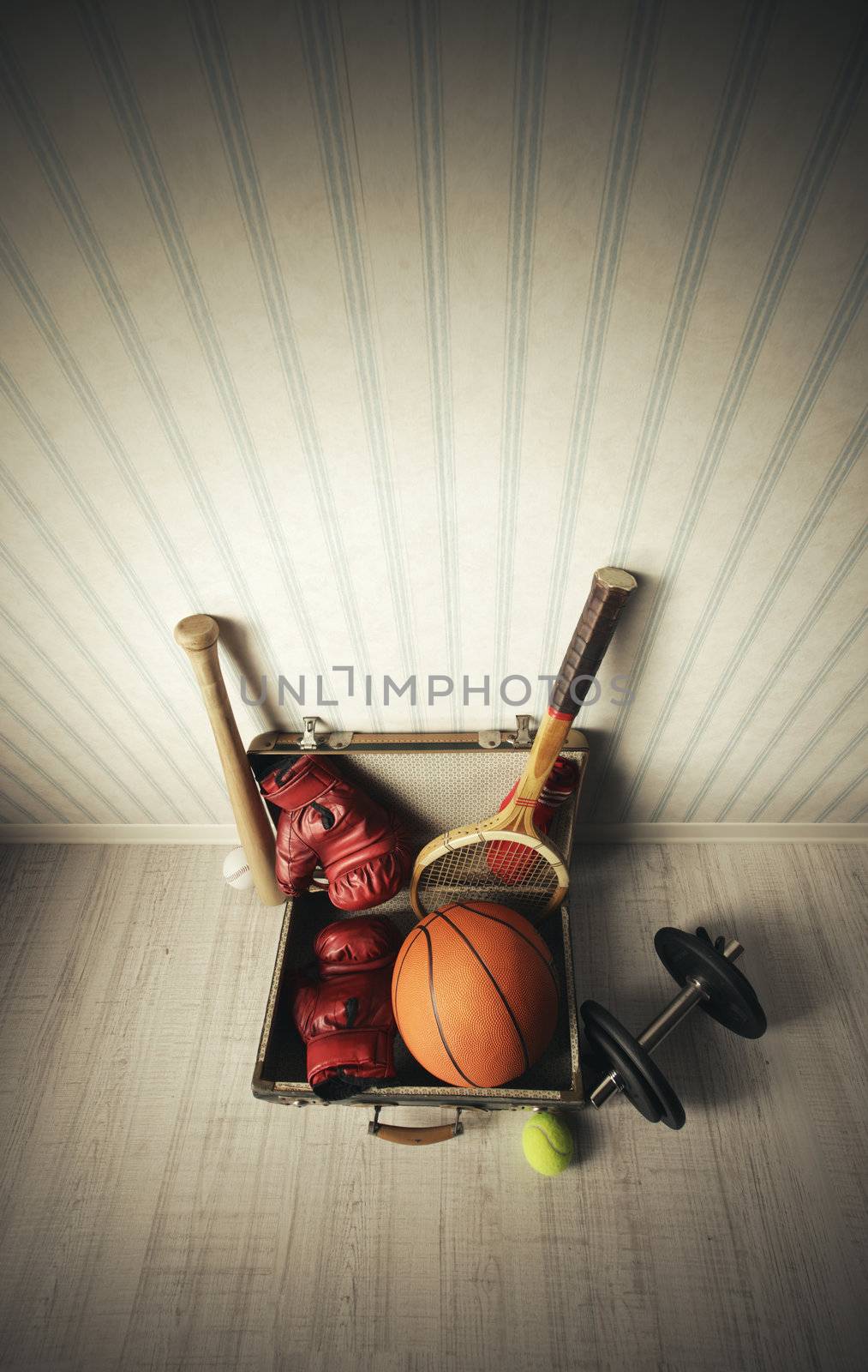 Old Suitcase with sports equipment