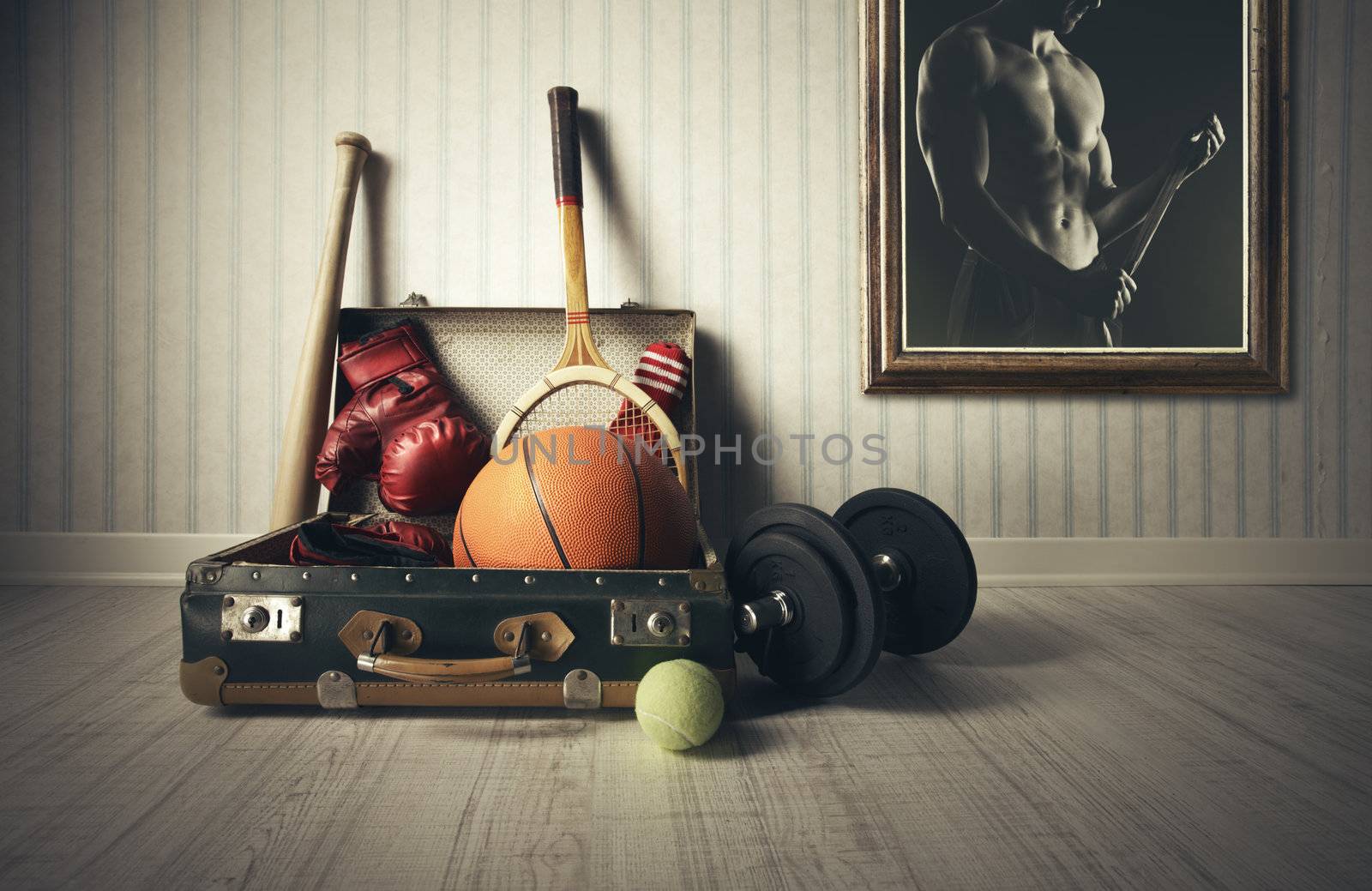 Old Suitcase with sports equipment and athlete photo