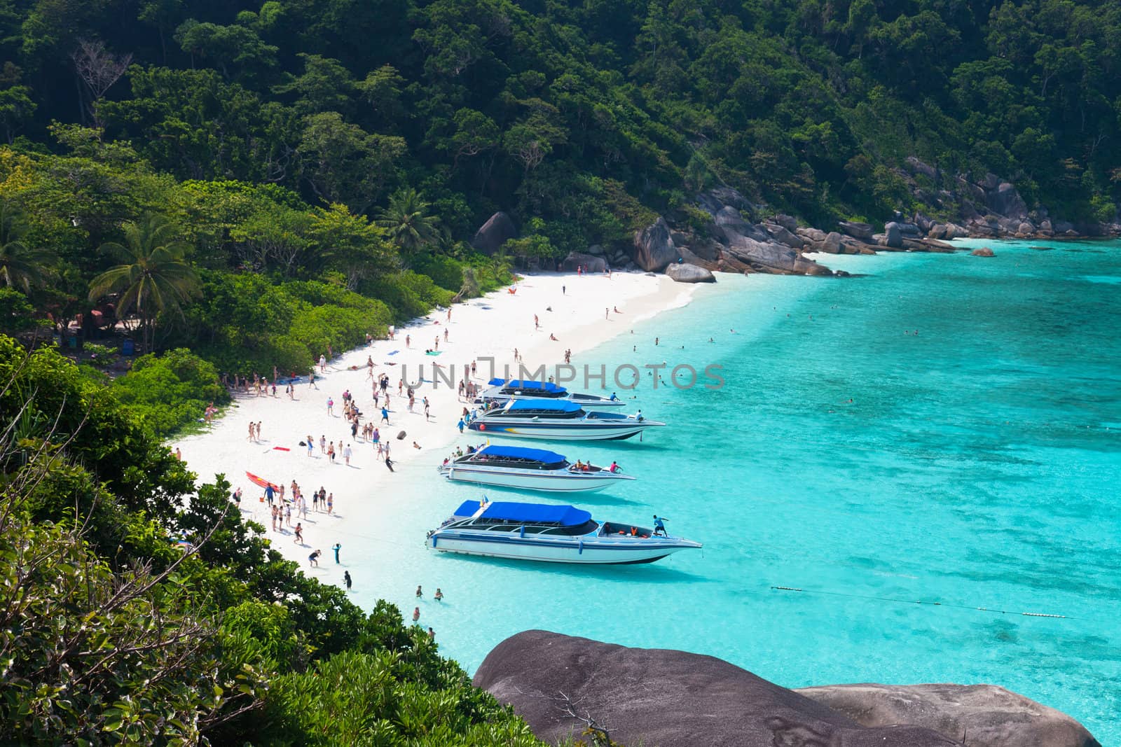 Tourists on a beach on Similan's island, Thailand by elena_shchipkova