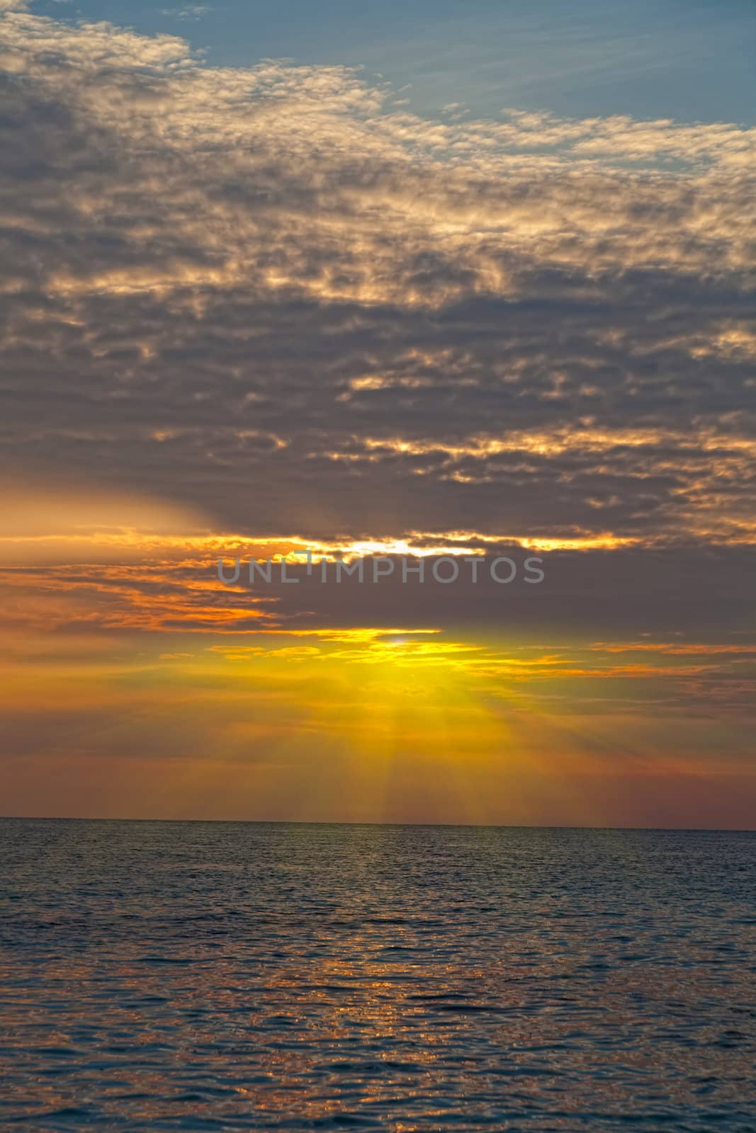 Bright beams of a rising sun over the sea, Thailand by elena_shchipkova