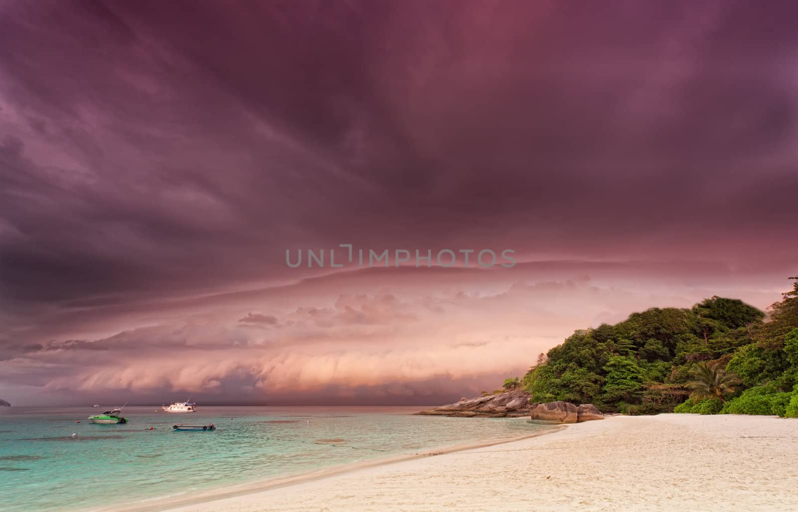 Sandy beach at sunset before a thunder-storm, Thailand