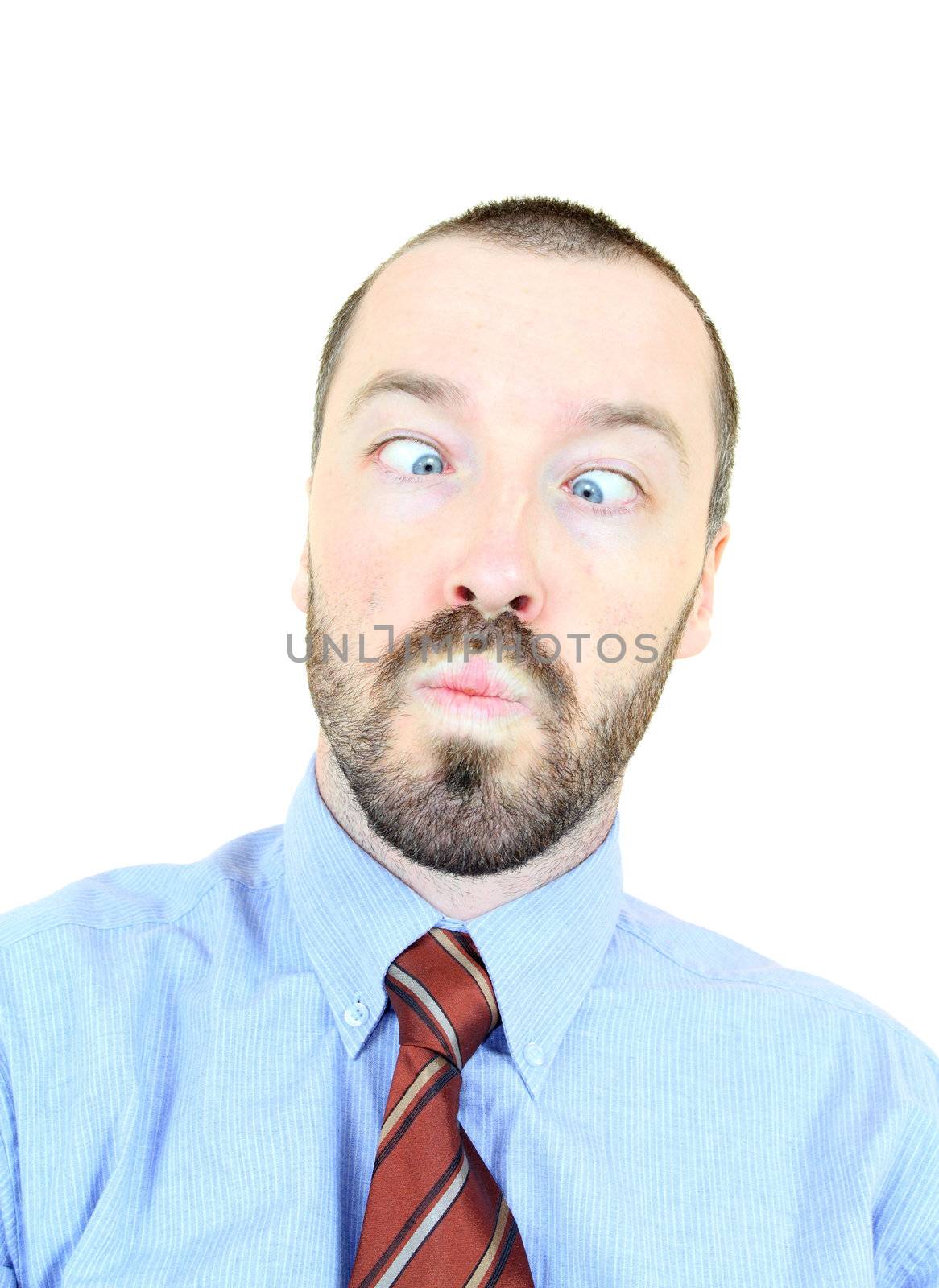Silly businessman pulling faces and squinting eyes. Young adult near his 30s - portrait isolated against white background. Short-haired male.