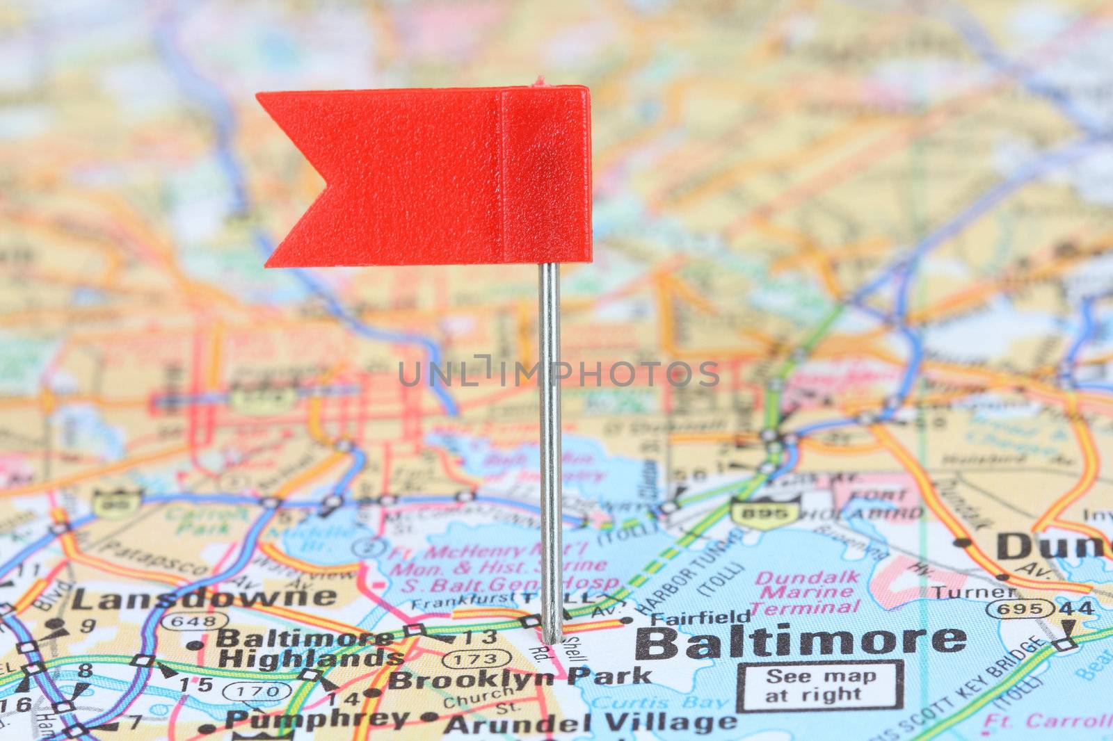 Baltimore, Maryland. Red flag pin on an old map showing travel destination.
