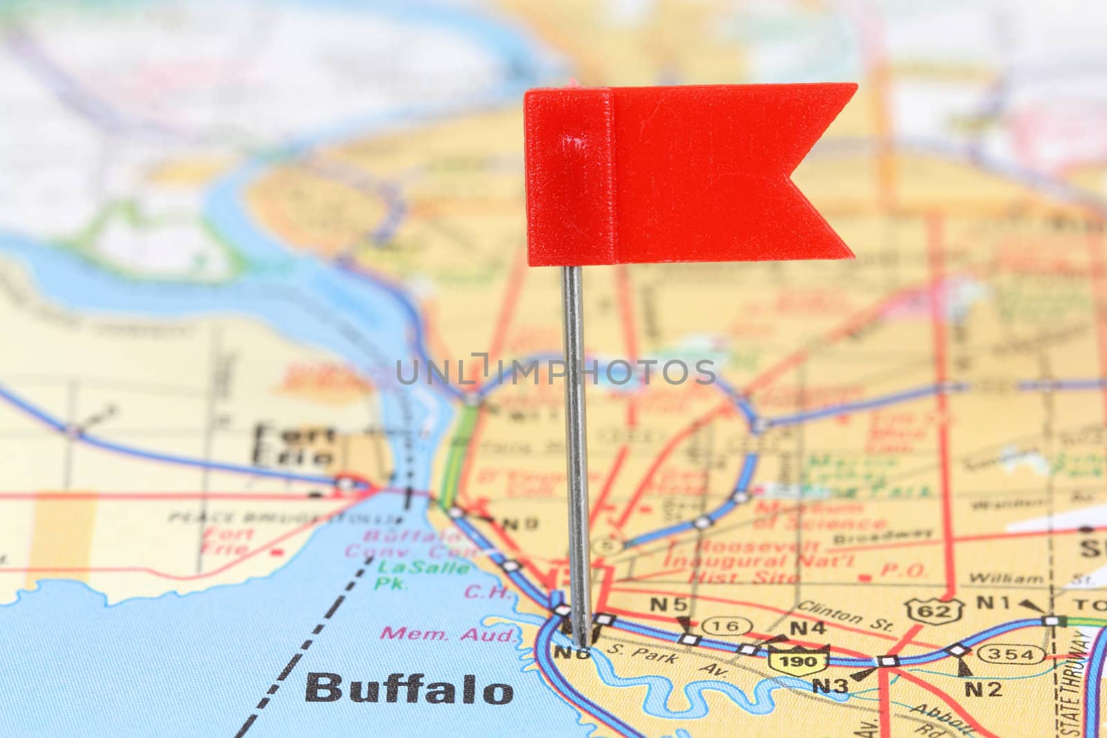 Buffalo, New York. Red flag pin on an old map showing travel destination.