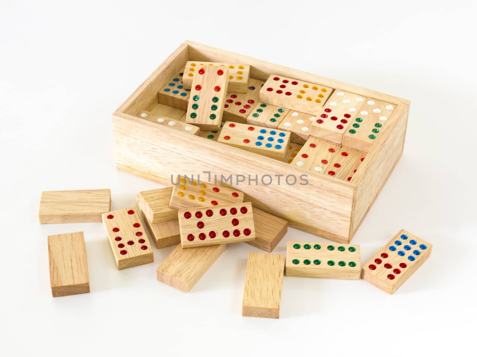 Wooden Domino in wooden box against the white background