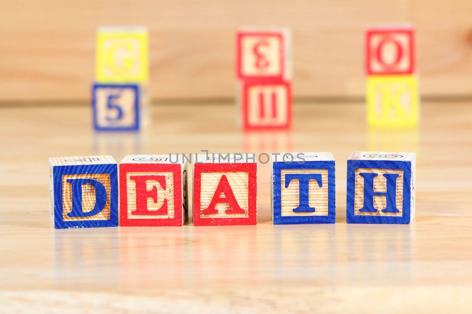 Wooden blocks with letters. Educational toy concept - children learning about death.