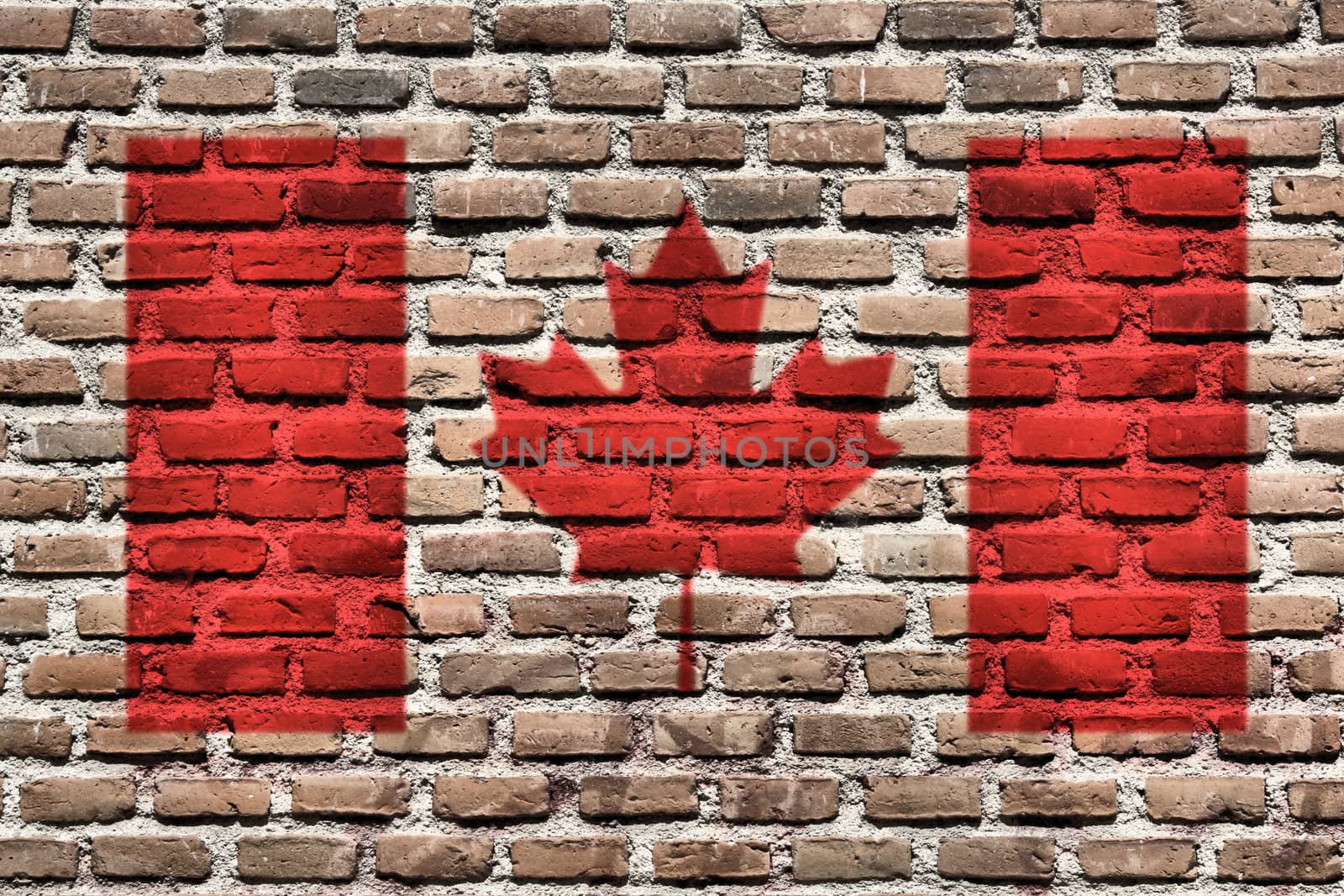Canada national flag spray painted on a brick wall. Grunge graffiti.