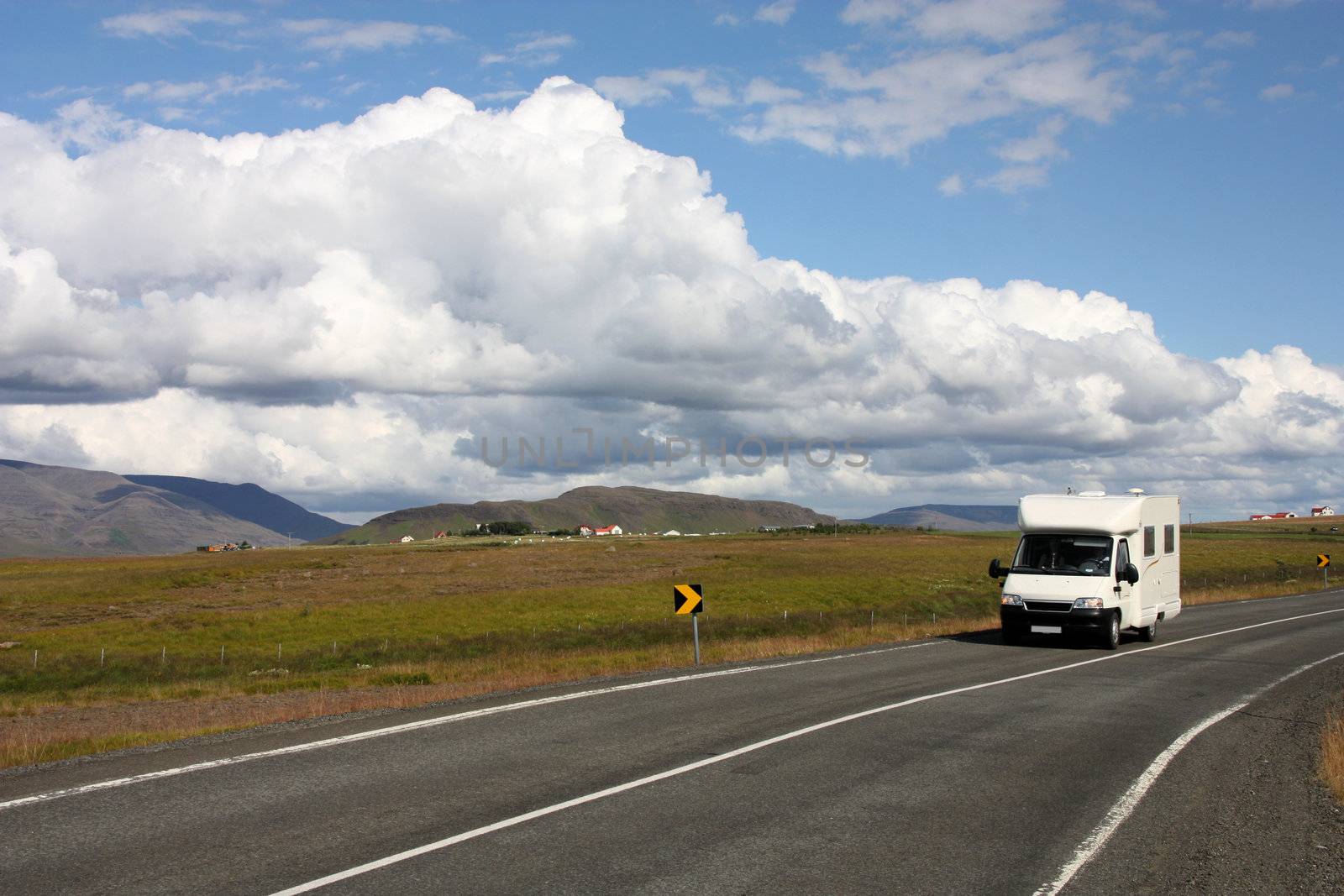 Generic motorhome, recreational vehicle in Iceland. Camper van on the road next to Hvalfjordur.