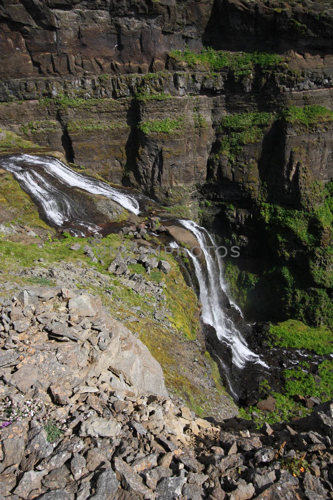 Glymur - tallest waterfall in Iceland. Beautiful mountain river canyon.