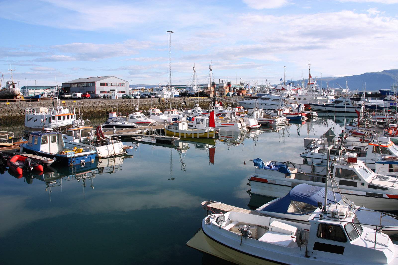 Reykjavik harbor. Motorboats, yachts and small fishing ships. All brand names and registration numbers removed.