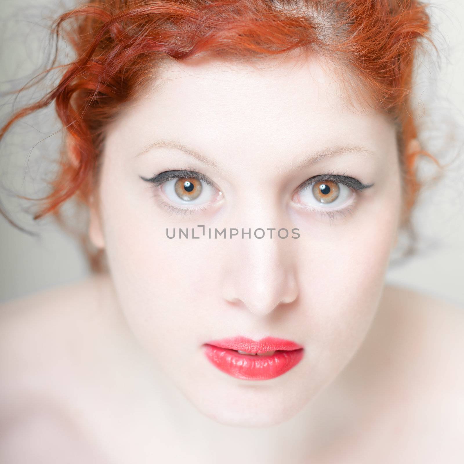 beautiful red hair and lips girl on white background