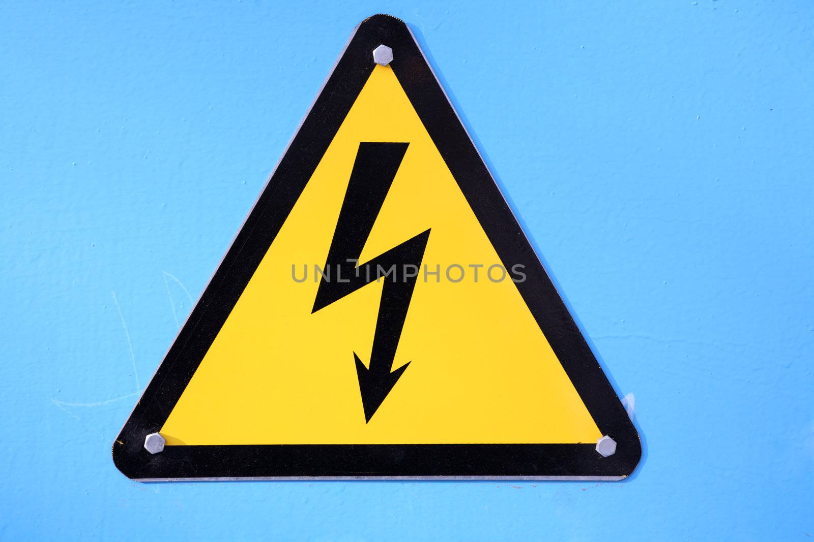 warning sign showing high voltage, focus point on center of photo