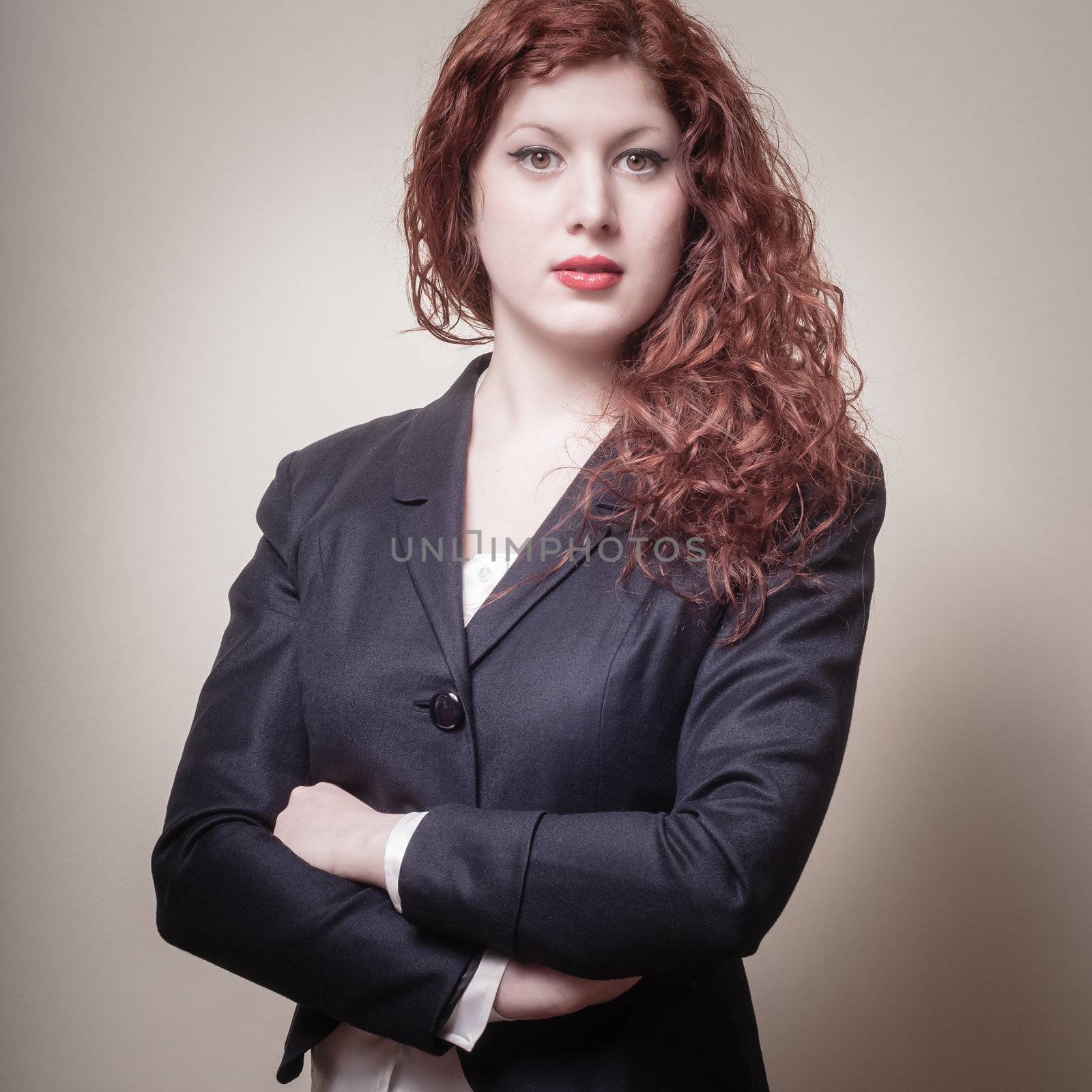 success business long red hair woman on gray background