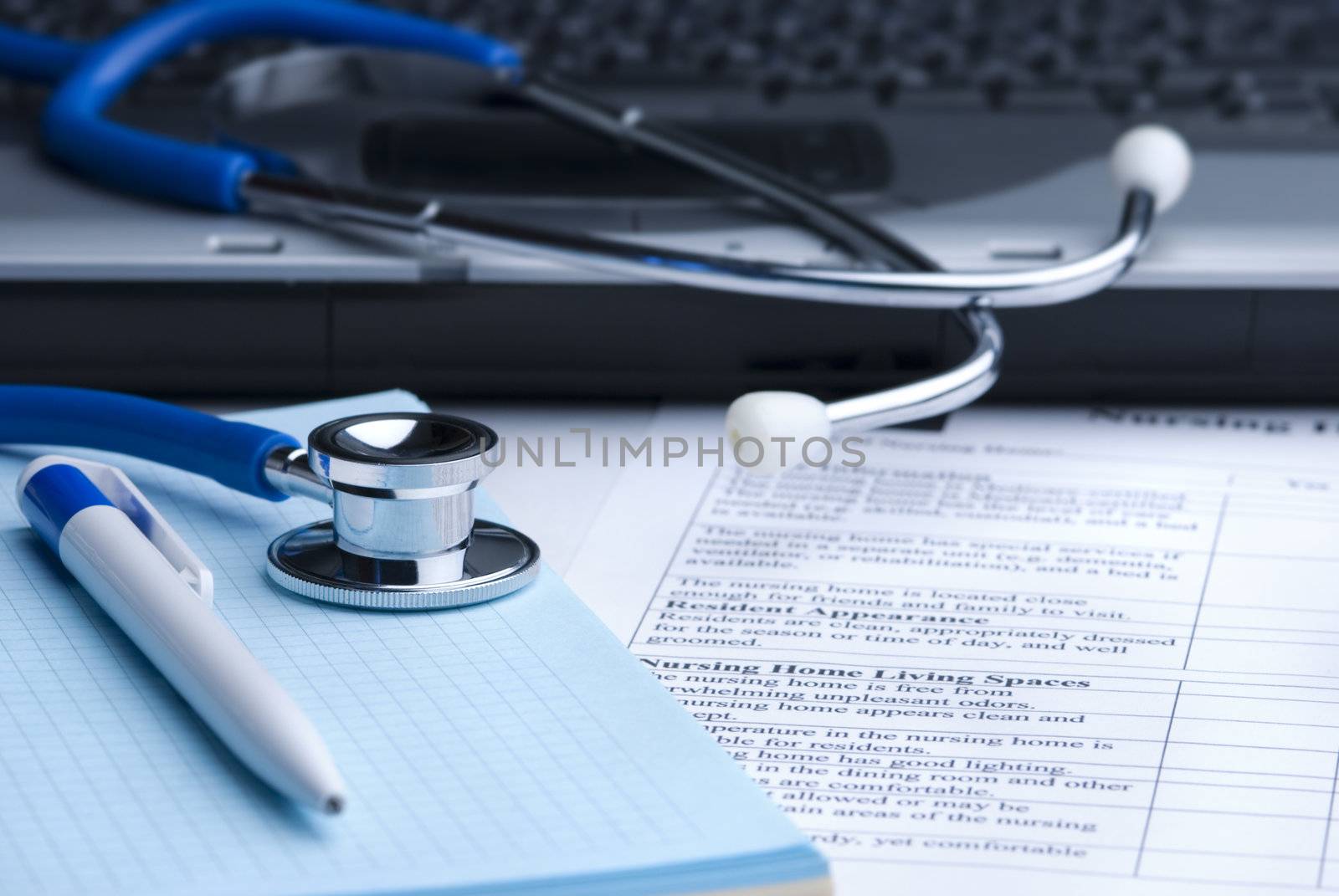 blue toned, focus point on metal part of stethoscope