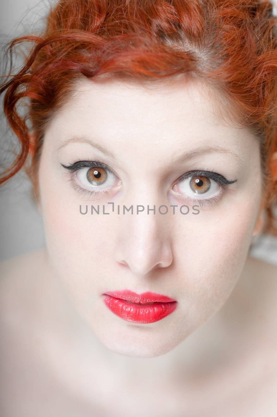 beautiful red hair and lips girl on white background