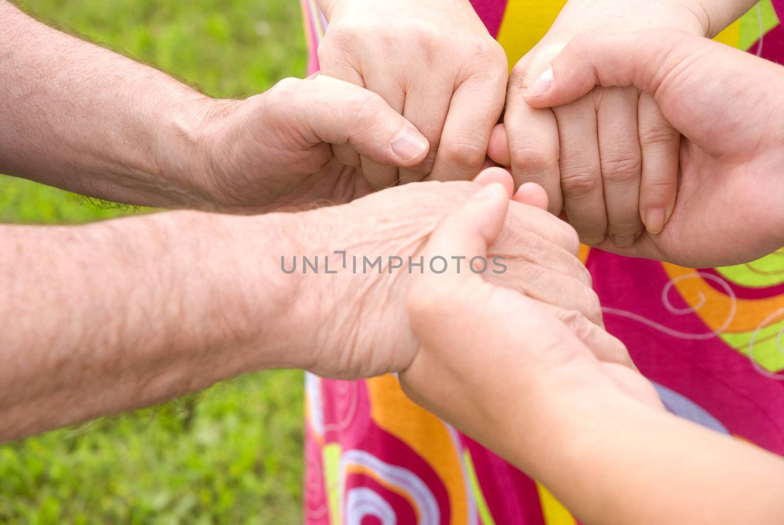 family concept (focus point on hands of the woman)