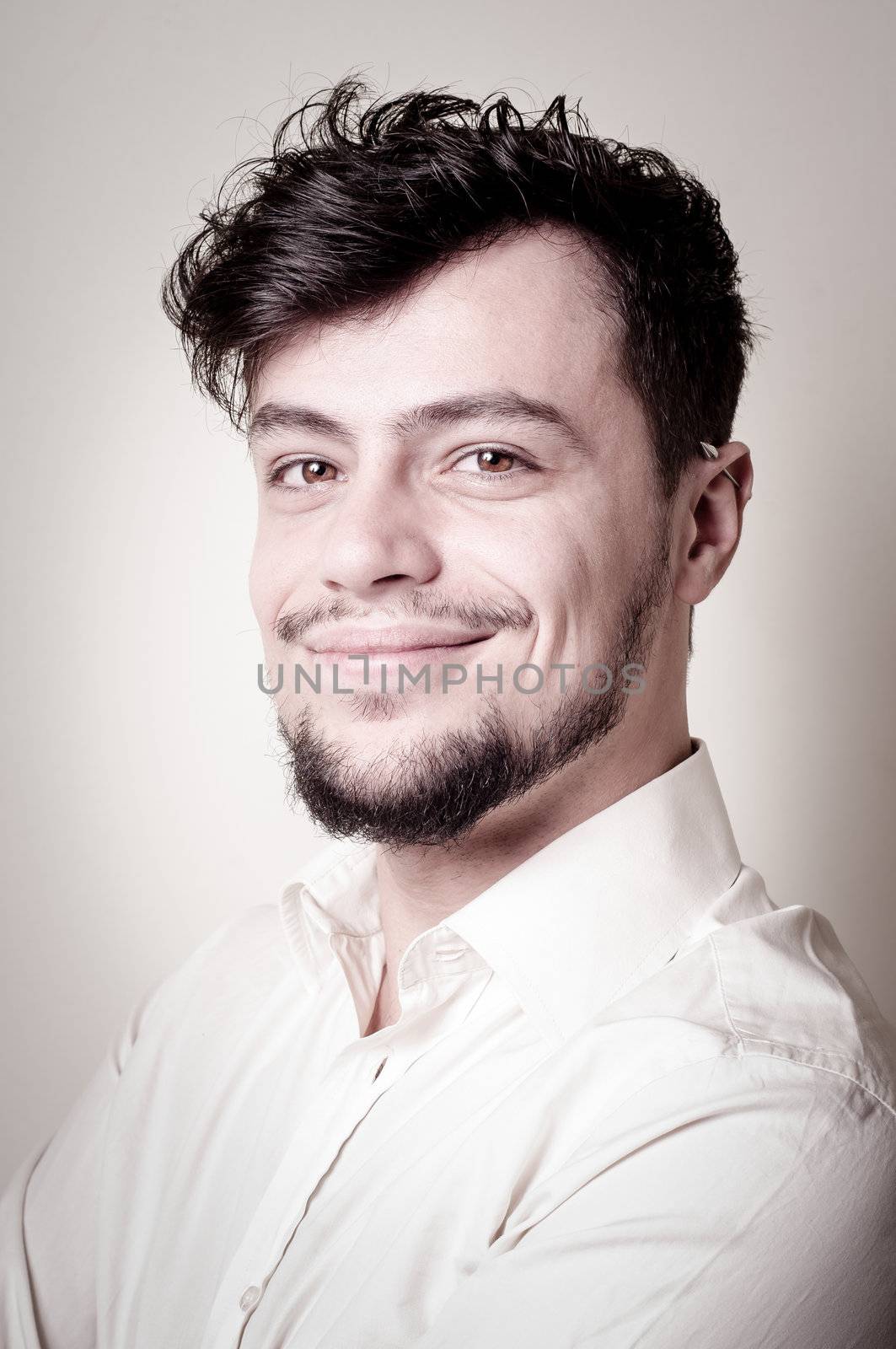 stylish modern guy with white shirt on gray background