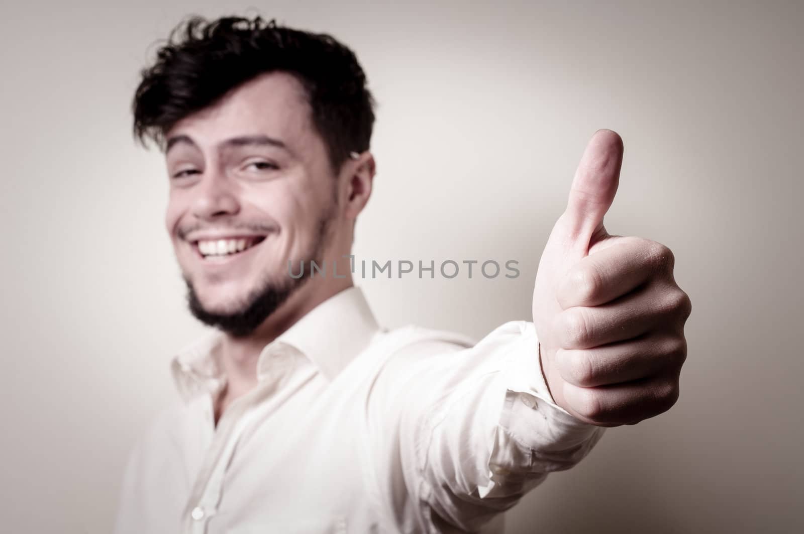 stylish modern guy with white shirt on gray background