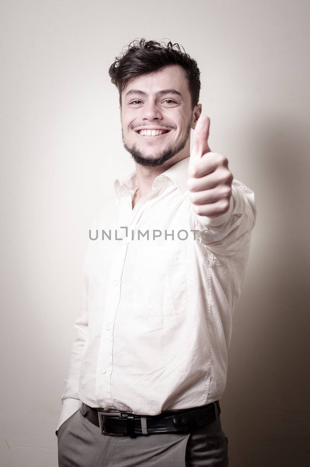 stylish modern guy with white shirt on gray background