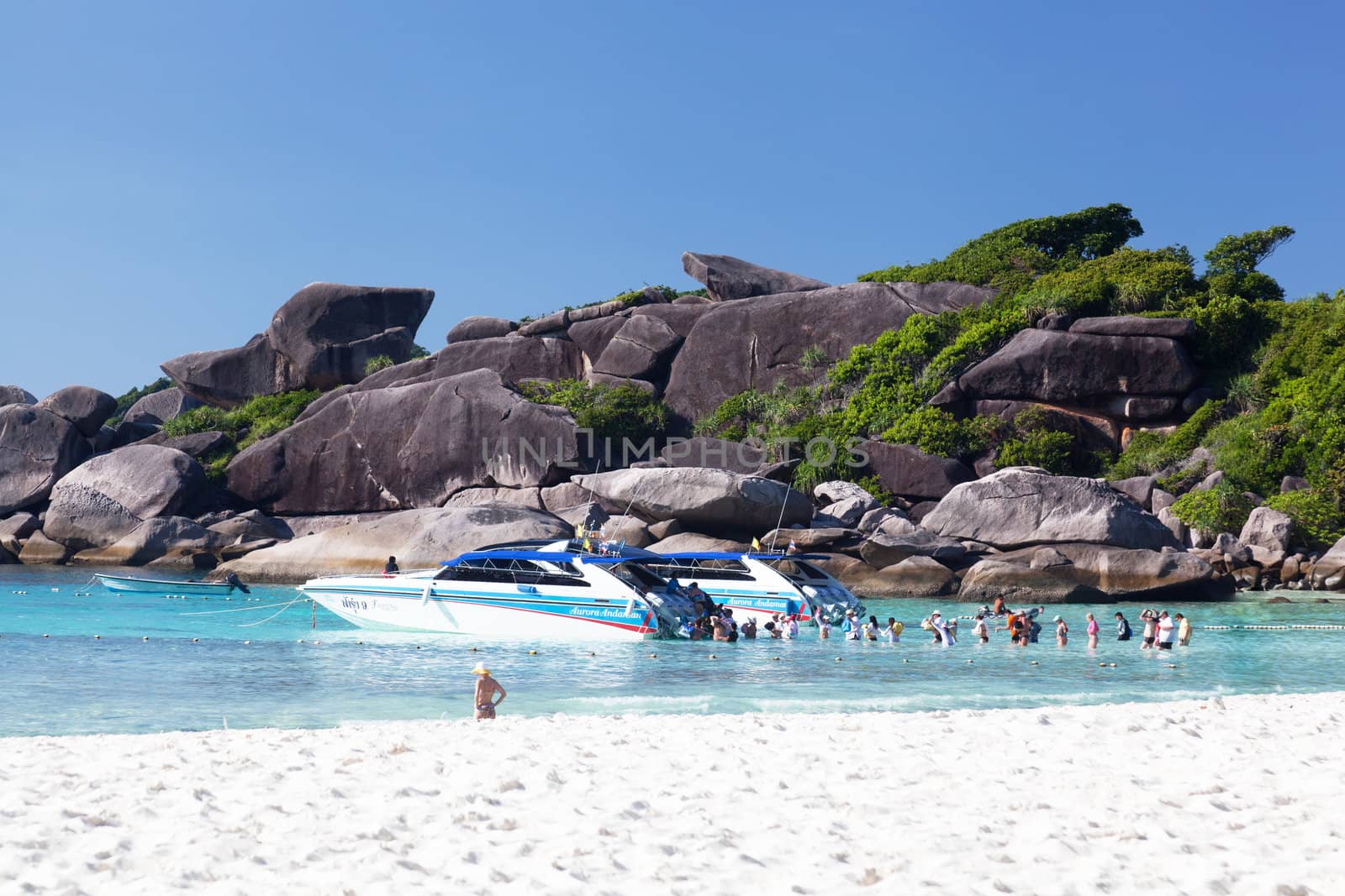 SIMILAN, THAILAND - MARCH 01: Tourists get into the boat, Similan islands, Thailand, 01.03.2012. On islands the untouched nature remained. Since 1982 the archipelago is declared by national park