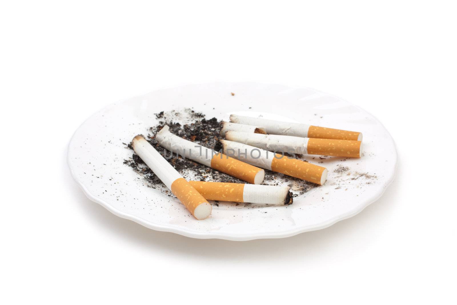 cigarette buts on plate by Kuzma