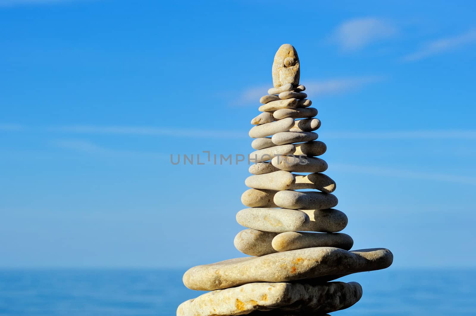Stack of the white pebbles against the sky