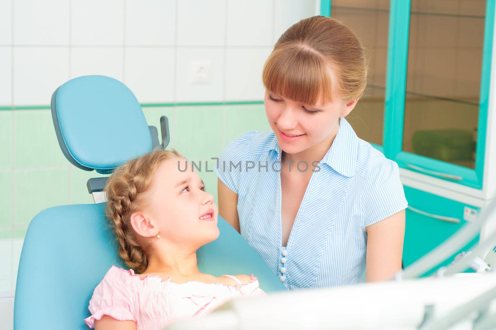 mother and daughter visit the dentist by adam121