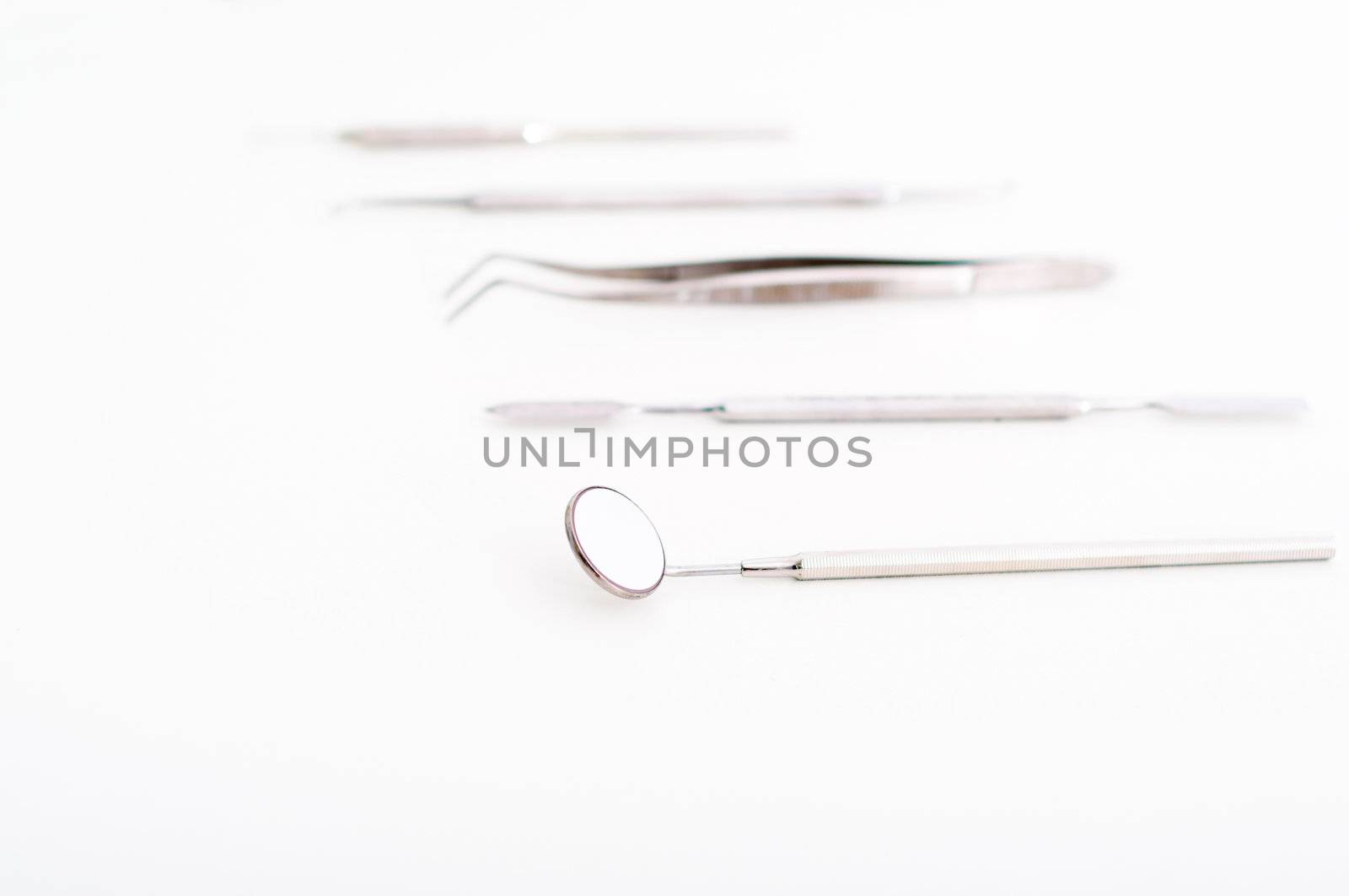 collection of medical instruments, on a light background