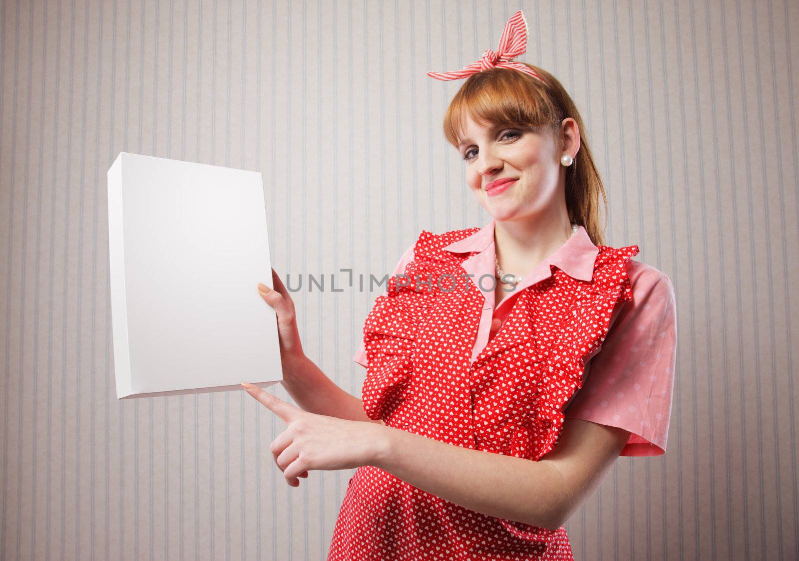 Housewife with a blank package of laundry detergent in her hand. Add your logo in it's place