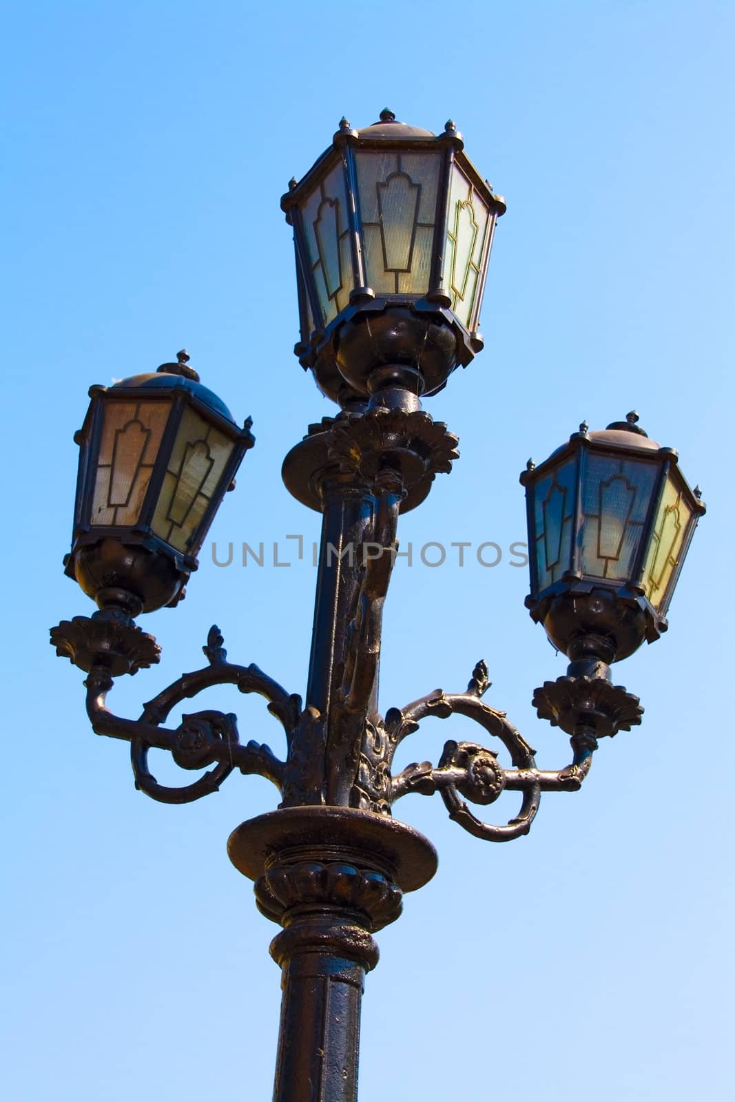 Old lantern on a blue sky backgrounds