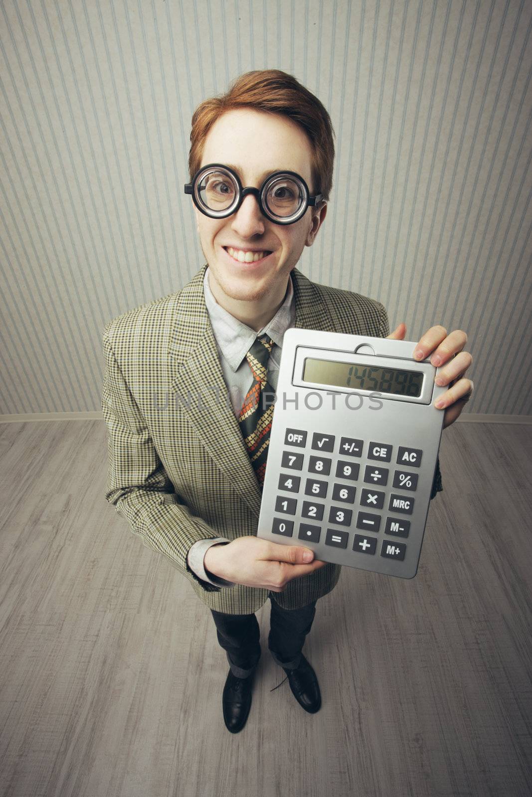 A nerdy guy with a giant-sized calculator 
