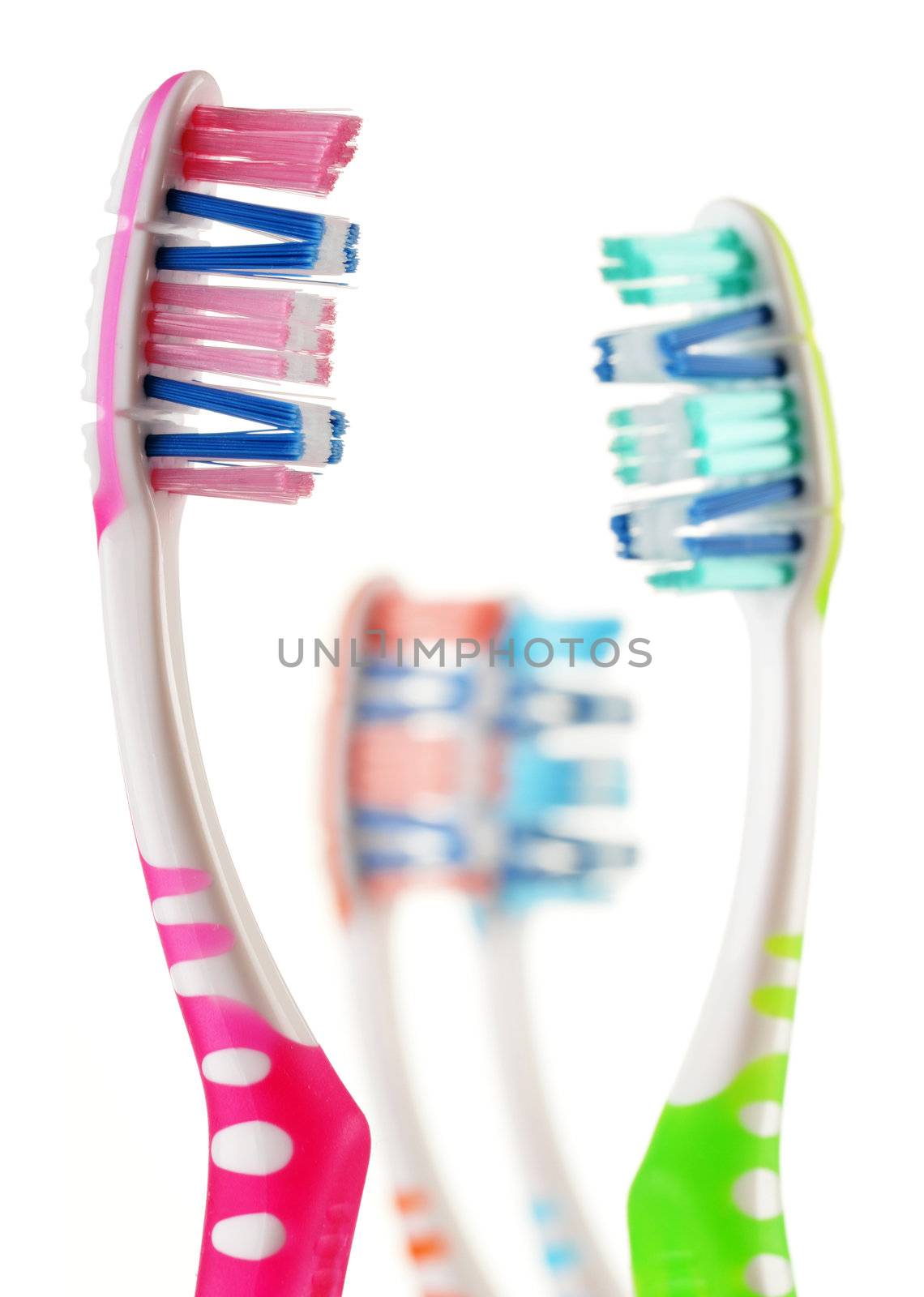 Composition with toothbrushes isolated on white  by monti