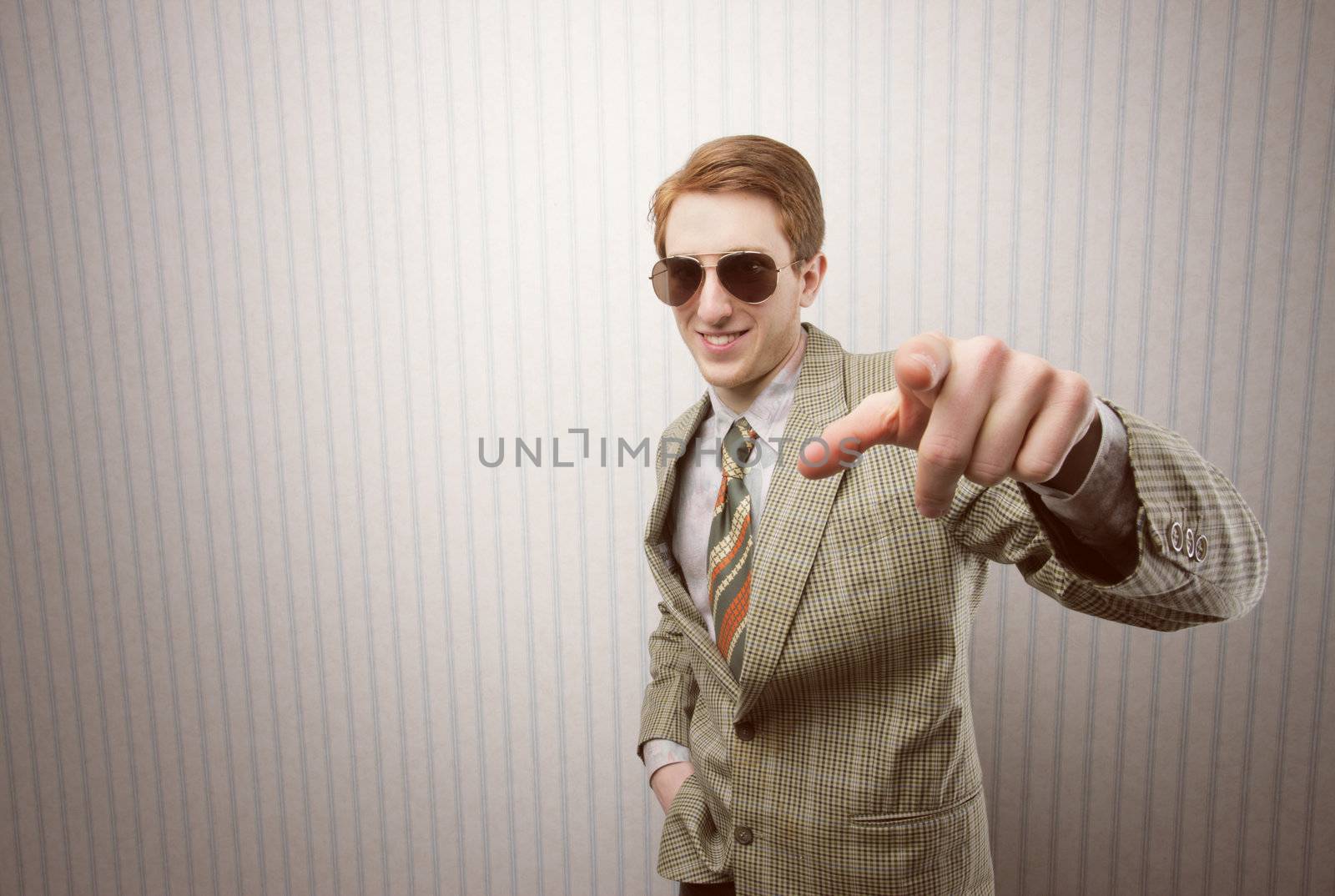 Funny retro businessman pointing his finger at you