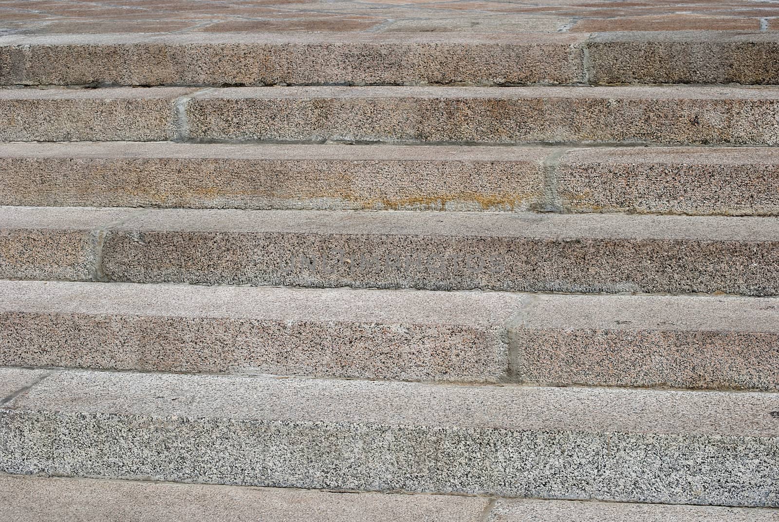 Granite stone stairs closeup in sunny day as background