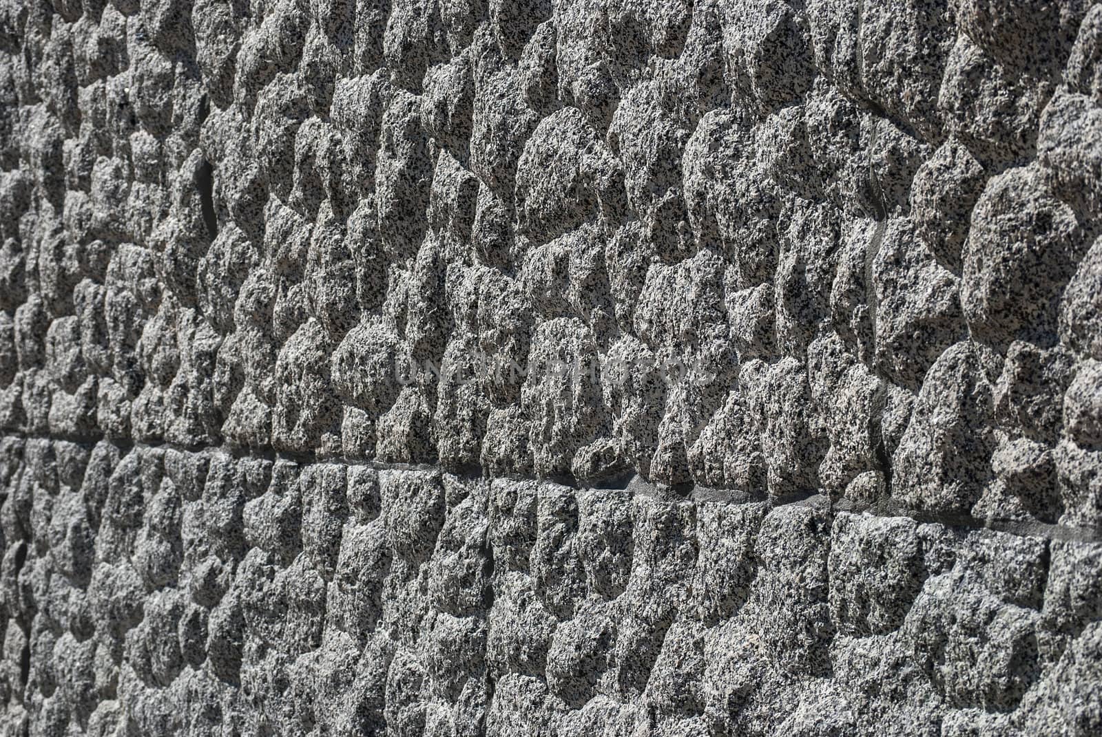 Granite block bumpy surface closeup as background