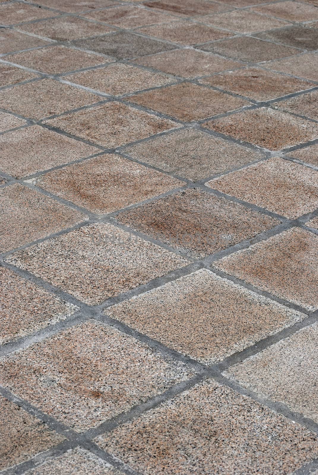 Pavement stone tiles close up as background