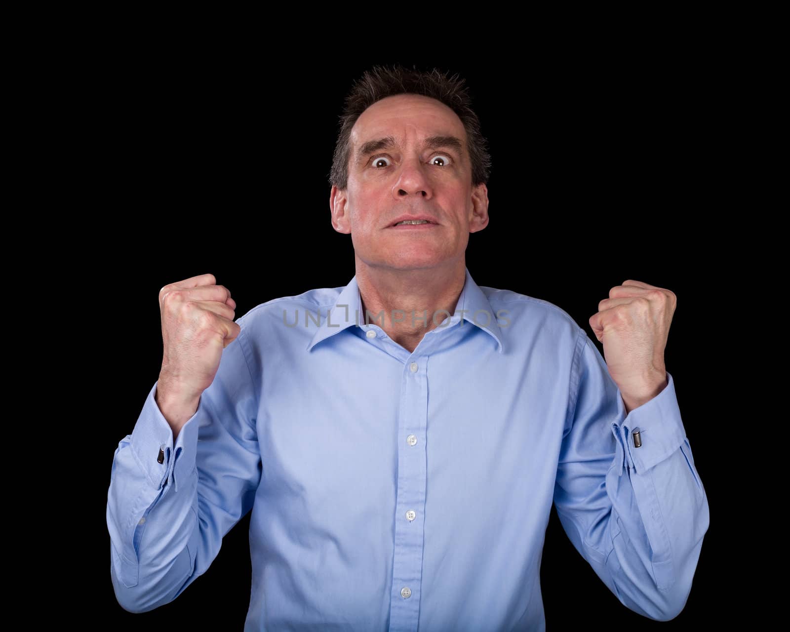 Frustrated Middle Age Business Man Shaking Fists in Anger Black Background