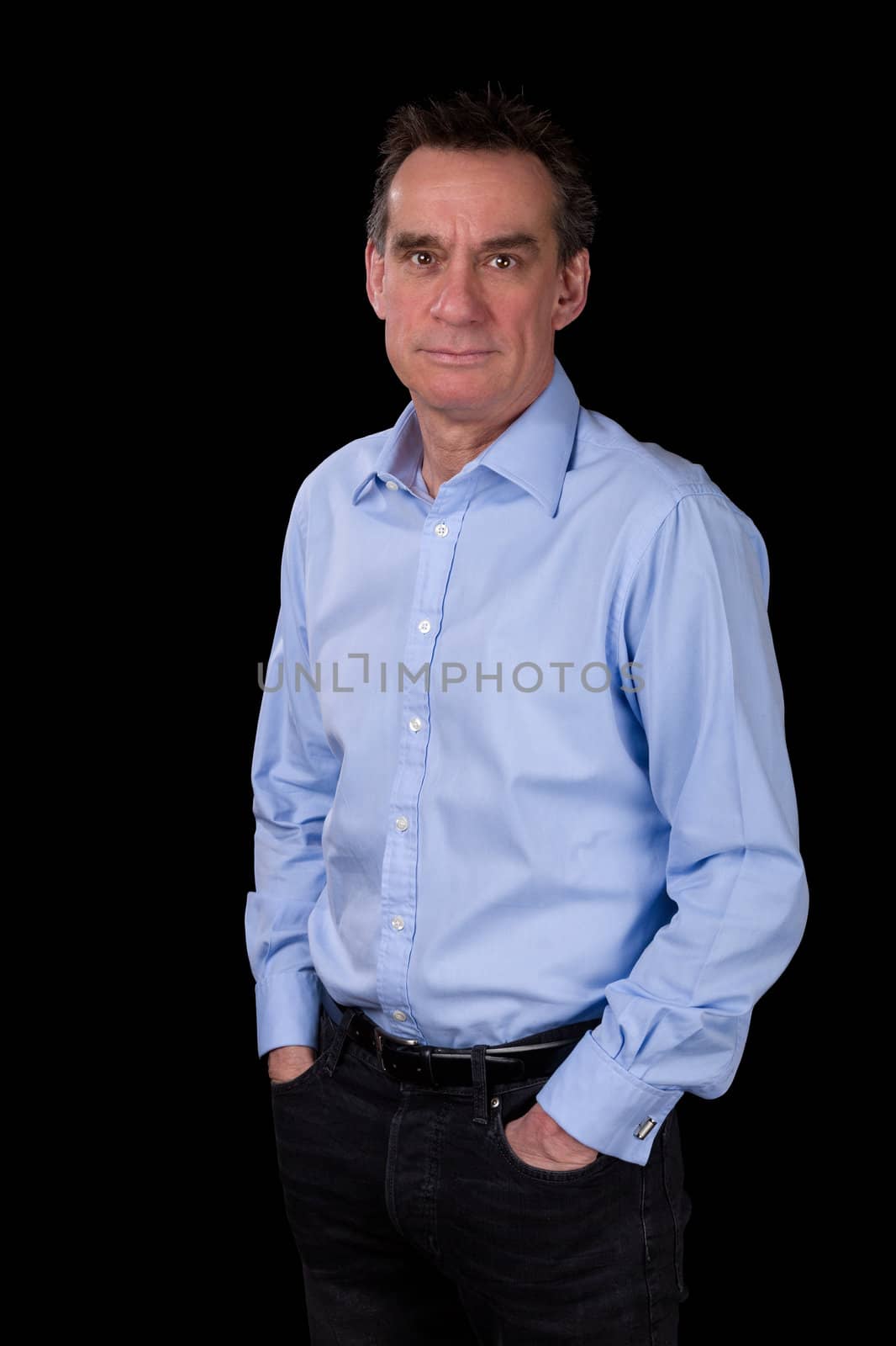 Portrait of Smiling Relaxed Middle Age Business Man in Blue Shirt Black Background