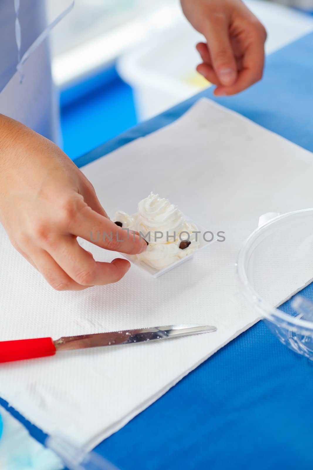 Woman preparing a dessert with cream