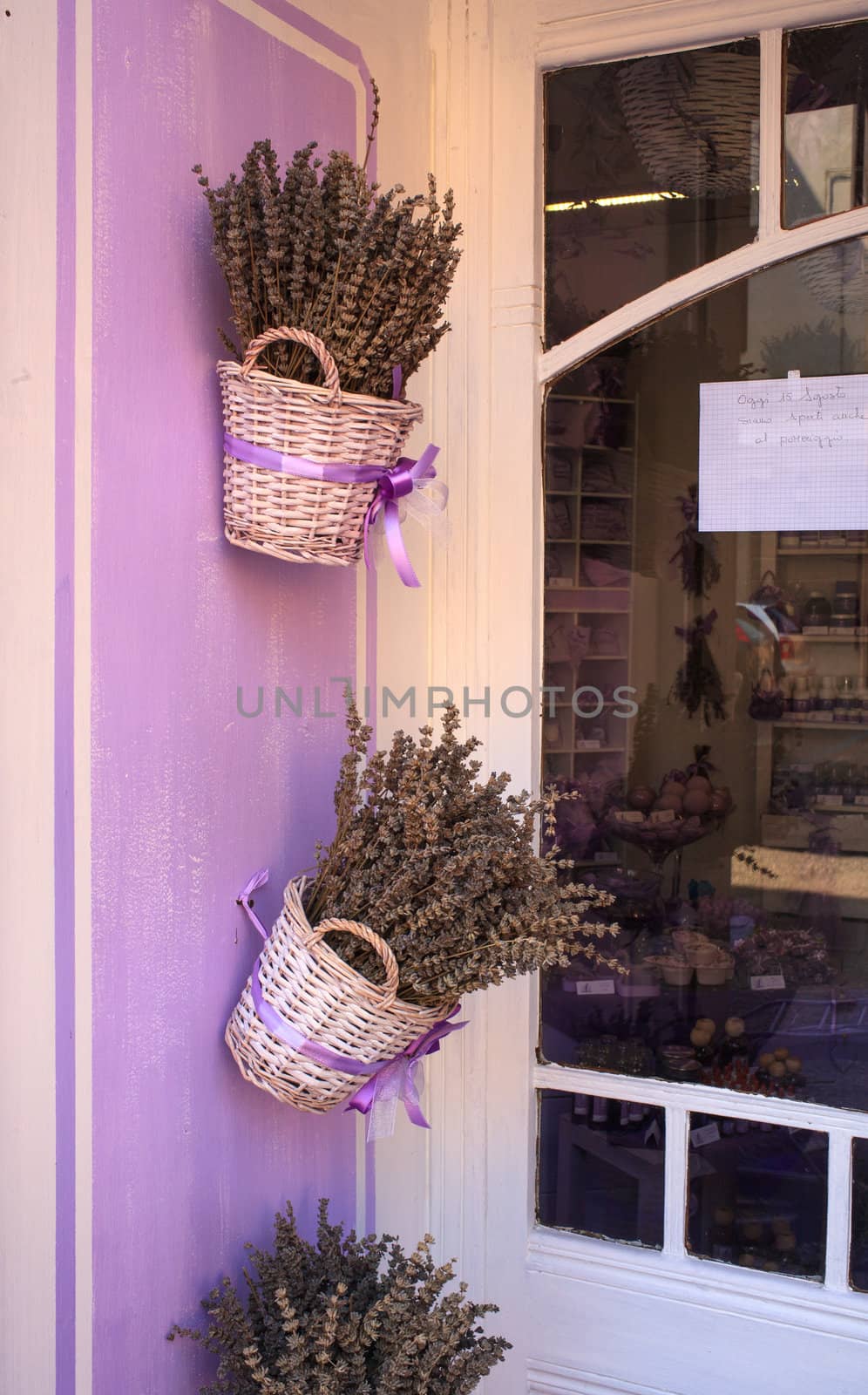 Wicker basket with lavender flowers by bepsimage